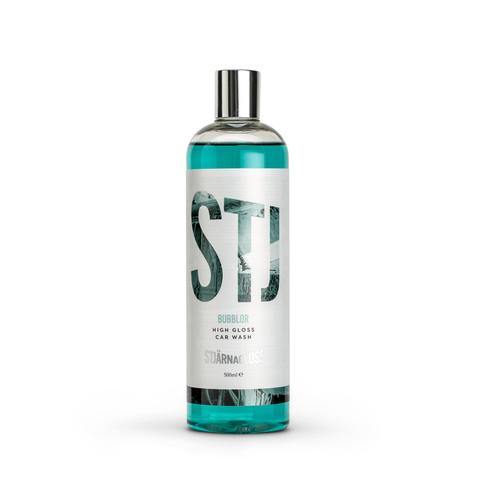 A bottle labeled "STJ Bubblor High Gloss Car Wash STARNAK USA" containing blue liquid, stands upright against a white background.