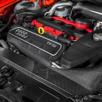 An Audi TFSI engine with a bright red intake manifold and "EVENTURI" branded carbon-fiber air intake system, housed inside a car's engine bay with a black and orange exterior.