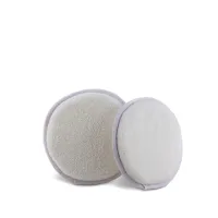 Two round, white, textured makeup-removal pads are placed side by side on a plain white background, with one slightly overlapping the other.