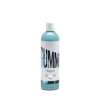A blue plastic bottle labeled "GUMMI Trim and Tyre Dressing Stjärnagloss 500ml" stands upright against a white background.