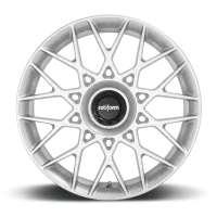 A white, multi-spoke alloy wheel with a central black cap labeled "rotiform," resting on a black surface against a plain background.