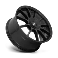 A black, ten-spoke car wheel rim is angled slightly to the right against a plain background. The center cap features the logo "rotiform."