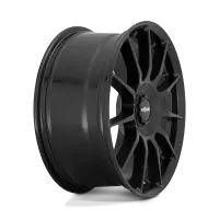 A black, multi-spoked aluminum car wheel rim with the brand name "rotiform" at the center; it stands upright against a plain white background.