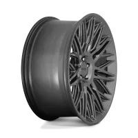 A matte black car wheel with intricate, angular spokes is positioned upright against a plain, light background. The central hub displays the brand name "rotiform."