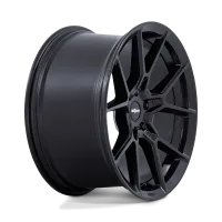 A matte black alloy car wheel with a multi-spoke design, standing against a plain, black background. Central hub features the text "rotiform."