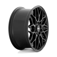 A black, multi-spoke car wheel rim stands vertically against a plain, gradient background. The center features the brand name "rotiform."