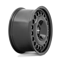 A dark gray car wheel rim with a circular pattern of oval cutouts, showcasing the "rotiform" logo at its center. The rim is positioned against a white background.
