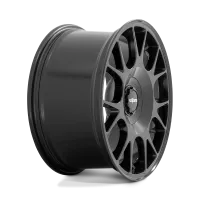 A black, multi-spoke wheel (racing or automobile) is positioned against a plain background. The center cap features the logo "rotiform."