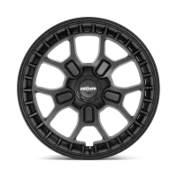 A black alloy wheel with the brand name "rotiform" in the center, featuring a unique geometric design of seven double spokes against a plain, light-colored background.