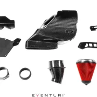 Components of a car air intake system, including carbon fiber ducts, heat shields, a red air filter, and metallic brackets, arranged against a white background, with the text “EVENTURI” at the bottom.