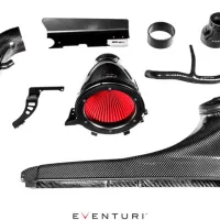 Carbon fiber automotive air intake components with a red air filter, assorted brackets, and tubes spread out on a white background. "EVENTURI" text is prominently displayed at the bottom.