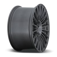 A black alloy car rim with a multi-spoke design is positioned upright against a white background. It features the text "ADV.1" on the center cap.