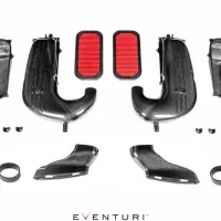 Carbon fiber air intake components with red filters arranged on a white background. The brand name "EVENTURI" in black and red is at the bottom. The setup includes hoses, tubes, and mounting hardware.