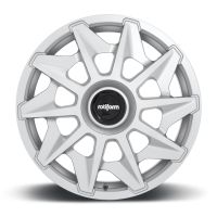 A silver alloy wheel featuring a starburst spoke design with a black center cap displaying the word "rotiform," positioned against a plain white background.
