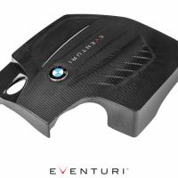 A black, carbon fiber engine cover with a BMW logo and "EVENTURI" text, displayed against a white background. (EVENTURI text repeated underneath the image).