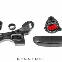 Carbon fiber automotive intake components are laid on a white background. Items include a red filter cone, various shaped ducts, and couplings. The text "EVENTURI" is prominently displayed below the items.