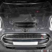 A Mini Cooper car with the hood partially transparent reveals the engine, parked inside a garage. Eventuri logo and text at the bottom right.