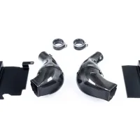 Two carbon fiber car air intakes are flanked by black metal brackets and two rubber hose clamps labeled "Eventuri" on a plain white background.