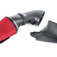 Carbon-fiber air intake system with a red cone filter, situated next to a separate carbon-fiber engine cover on a white background. The cover has "EVENTURI" written on it.