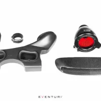 Several components of a car air intake system, including a curved intake tube, filter, coupling, clamp, and grille, are arranged on a white background. Text reads "EVENTURI."