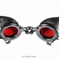 Two carbon fiber air intake tubes with red filters are mounted on a metal frame, shown against a white background. Text: "EVENTURI."