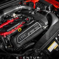 An Audi TFSI engine with a top cover displaying the Audi logo, situated in a vehicle engine bay with visible red and black components, Eventuri branding at the bottom center.