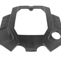 A carbon fiber engine bay cover with a textured finish lying on a white background. Text reads: Eventuri.
