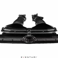Carbon fiber dual intake system by Eventuri on a white background; featuring sleek design with two tubes and air filter housings. Text: “EVENTURI” on tubes and beneath the intake.