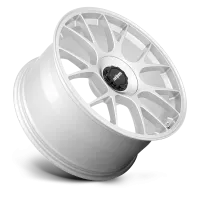 A white, multi-spoke alloy wheel rests against a white background. The wheel's central cap features a black and white logo with the text "rotiform" in lowercase letters.