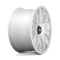 A white multi-spoke alloy car wheel with "rotiform" labeled in the center, set against a plain, light background.