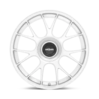 A white car wheel rim with a multi-spoke design; at the center is a black hubcap bearing the text "rotiform." The bottom of the rim is labeled "FORGED."