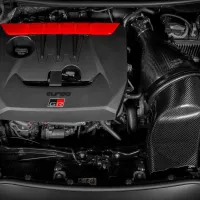 A car engine with "turbo GR" branding is situated centrally; it displays a red accent on the top and is surrounded by various mechanical components and pipes.
