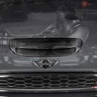 A Mini Cooper's front view with a transparent hood revealing the engine and components underneath. "Eventuri" and a stylized "S" are printed at the bottom right corner.