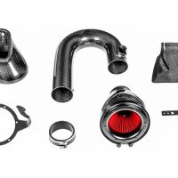 Carbon fiber car parts, including an air intake system with a red filter, a curved pipe, a bracket, and other components, are laid out on a white background for display.