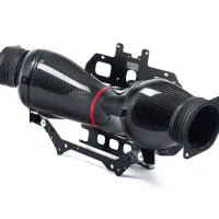 A carbon fiber car air intake assembly, featuring curved, glossy black tubes and mounted on a black metal bracket in a white, well-lit studio setting.