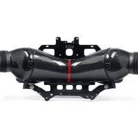 A carbon fiber automotive intake assembly with a central red stripe rests on a black mounting bracket, positioned against a plain white background.