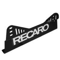A black metal bracket with an angled design features the white text "RECARO" centered on its surface. The bracket includes multiple slots and cutouts, suggesting it is for mounting or securing.