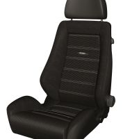 A black, contoured car seat with an adjustable headrest, white stitching, and "RECARO" branding in the middle, set against a plain white background.