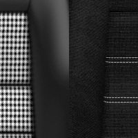 Two car seats, one with a black-and-white houndstooth pattern, the other with black fabric and white stripes. Both display the "RECARO" logo in the center.