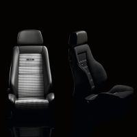 Four car seats are aligned in a row against a black background, showcasing different upholstery designs, including plain leather, checkered fabric, and cloth. Labels reading "RECARO" are visible on two seats.