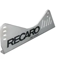 Metal seat bracket labeled "RECARO ABE Adapter," featuring bolt slots and adjustment holes, displayed against a white background. "APMotorsport" logo appears at the bottom right corner.
