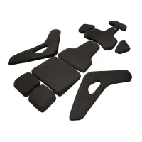 Black, ergonomically-shaped cushioning pads are displayed spread out on a white background. The pieces vary in shape and size, evidently designed for assembling together, likely for body-support purposes.