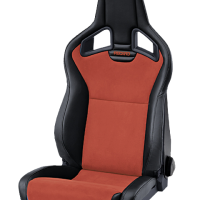 A black and red sporty car seat labeled "RECARO," shown in an isolated, indoor setting.