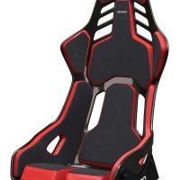 Black and red racing seat with cutouts, angled backrest, and side supports. Text "RECARO" appears on the headrest and seat base. Context is a plain, white background.