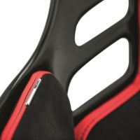 A black and red racing-style seat with "RECARO" text on a metal label features a sleek design and cutout elements, highlighting its sporty and ergonomic attributes.