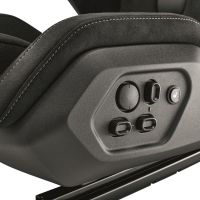 A car seat panel with buttons and knobs for adjustments, including a seat heater, set against a background of black, cushioned material with white stitching.
