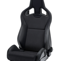 A black reclining racing seat, with prominent side bolsters and a contoured backrest, sits isolated on a white background. The word "Sparco" is engraved on the upper section.