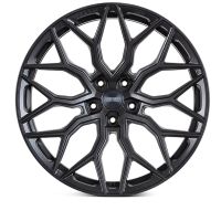A black alloy wheel features an intricate, geometric spoke design with "VOSSEN FORGED" text on the central cap. It is displayed against a white background.