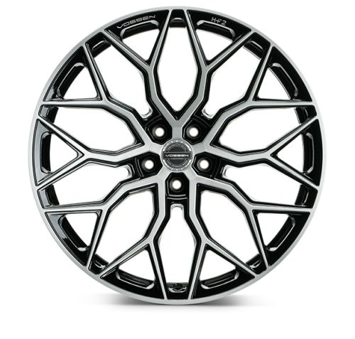A black and silver alloy wheel with intricate, geometric spokes. Text reads: "VOSSEN" and "HF-2" on the rim and center. Set against a white background.