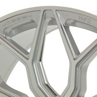 A metallic alloy wheel featuring a geometric spoke design, labeled with "VOSSEN" and "HF-2," set against a plain background.